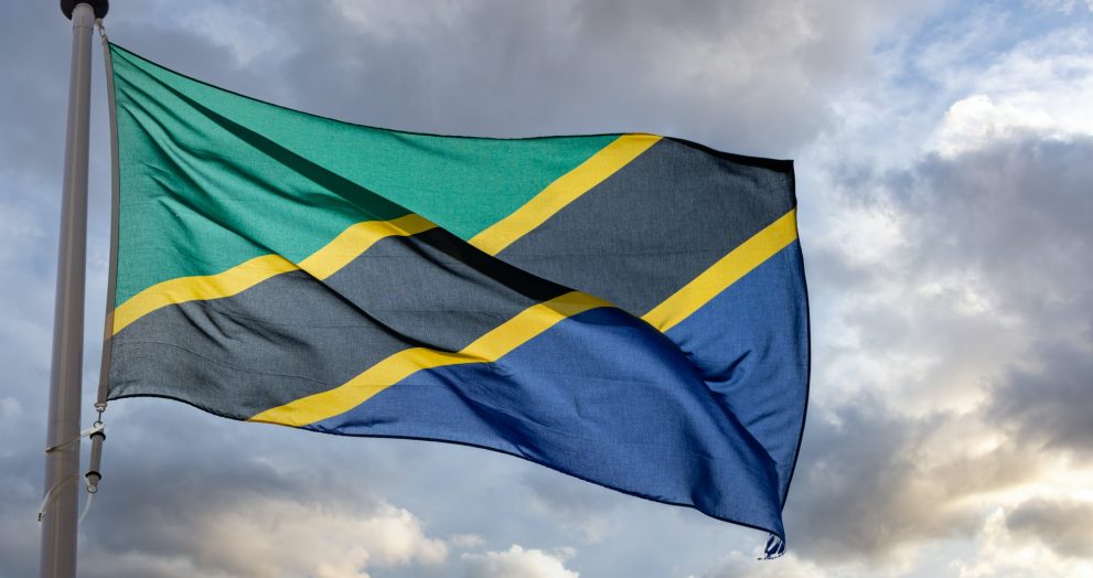 Tanzania flag waving against cloudy sky